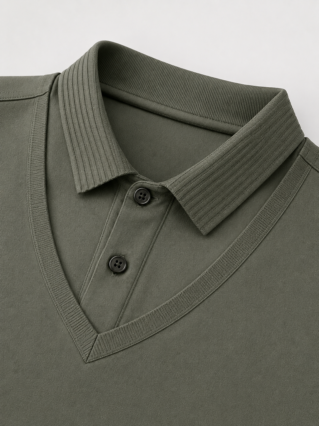 Close up of army green polo shirt showing soft lightweight fabric and refined collar detail