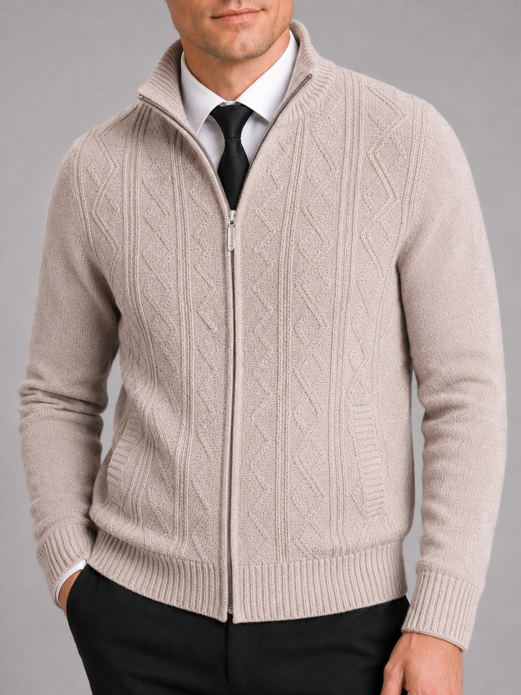 Close up of beige full zip sweater showing thick knit texture and stand collar detail