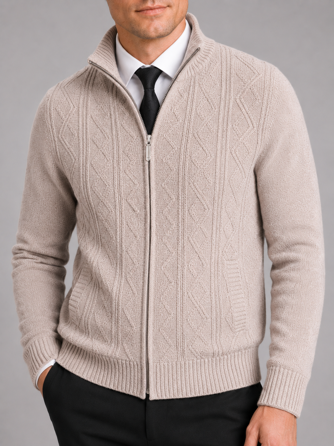 Close up of beige full zip sweater showing thick knit texture and stand collar detail