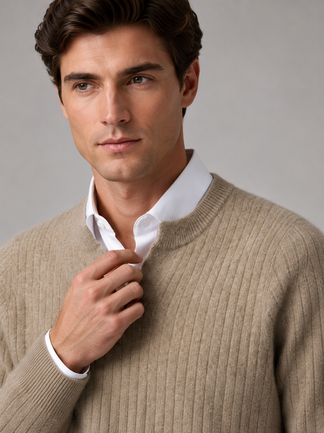 Close up of khaki merino wool sweater showing soft fine knit texture and refined open collar detail