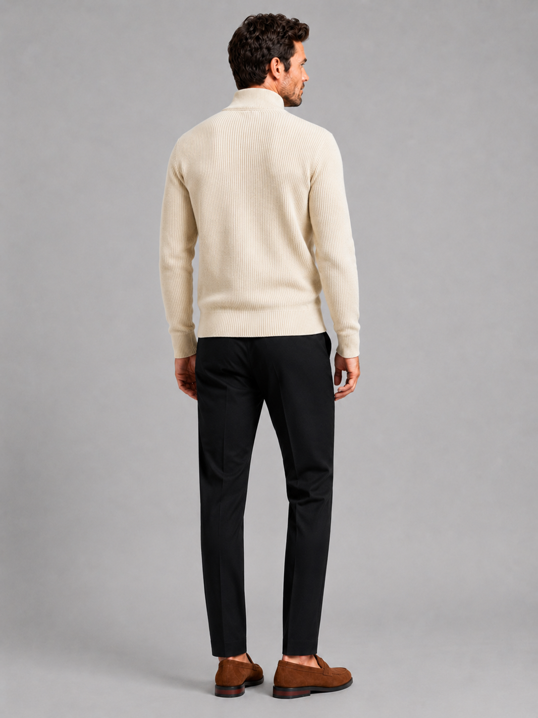 Back view of a man wearing a beige ribbed knit cardigan showing the slim fit, long sleeves, and textured knit construction