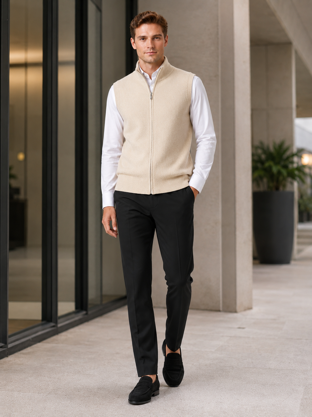 Man styling beige full zip sweater vest in a clean business casual and everyday lifestyle outfit