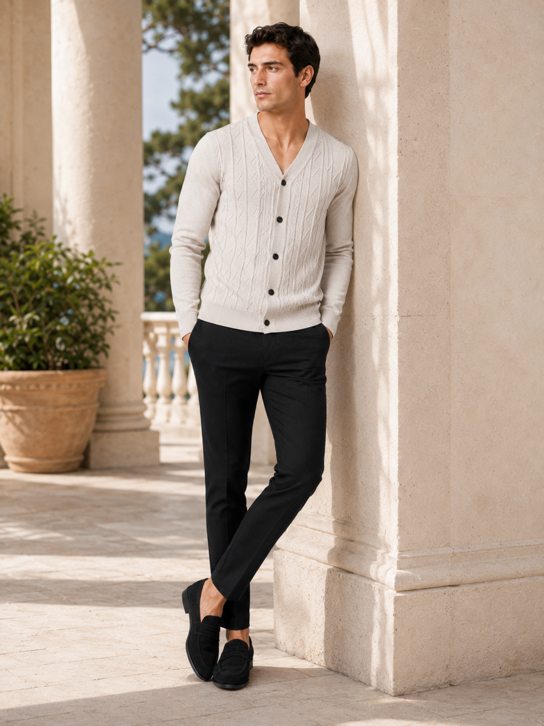 Man styling beige v neck cardigan sweater in a refined everyday smart casual outfit