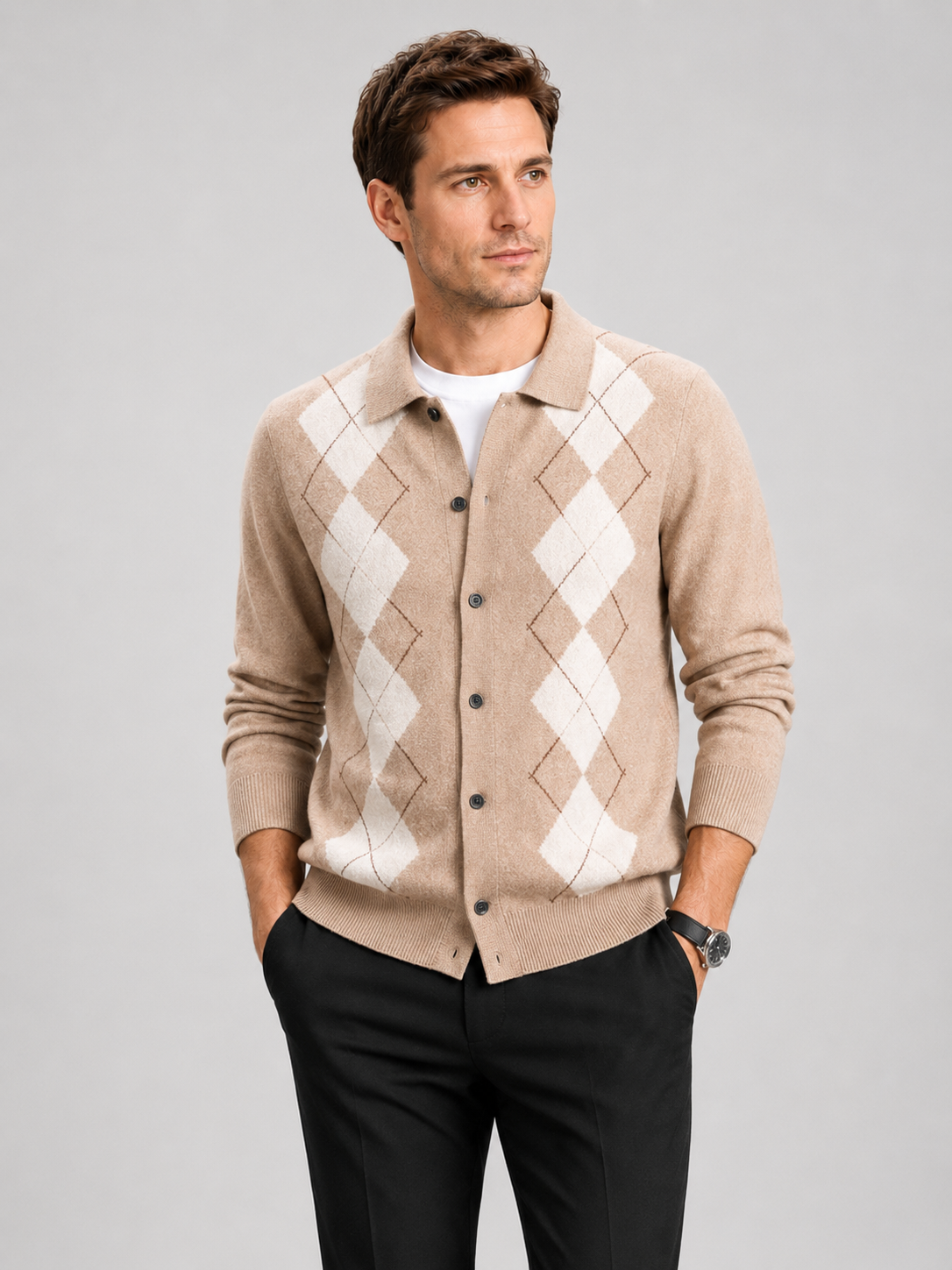 Front view of a man wearing a black argyle cardigan sweater with a button-down front, turn-down collar, long sleeves, and thick knit texture