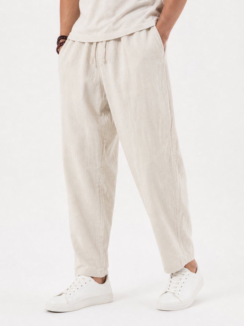 Men wearing beige drawstring pants breathable loose fit lightweight summer coastal casual style