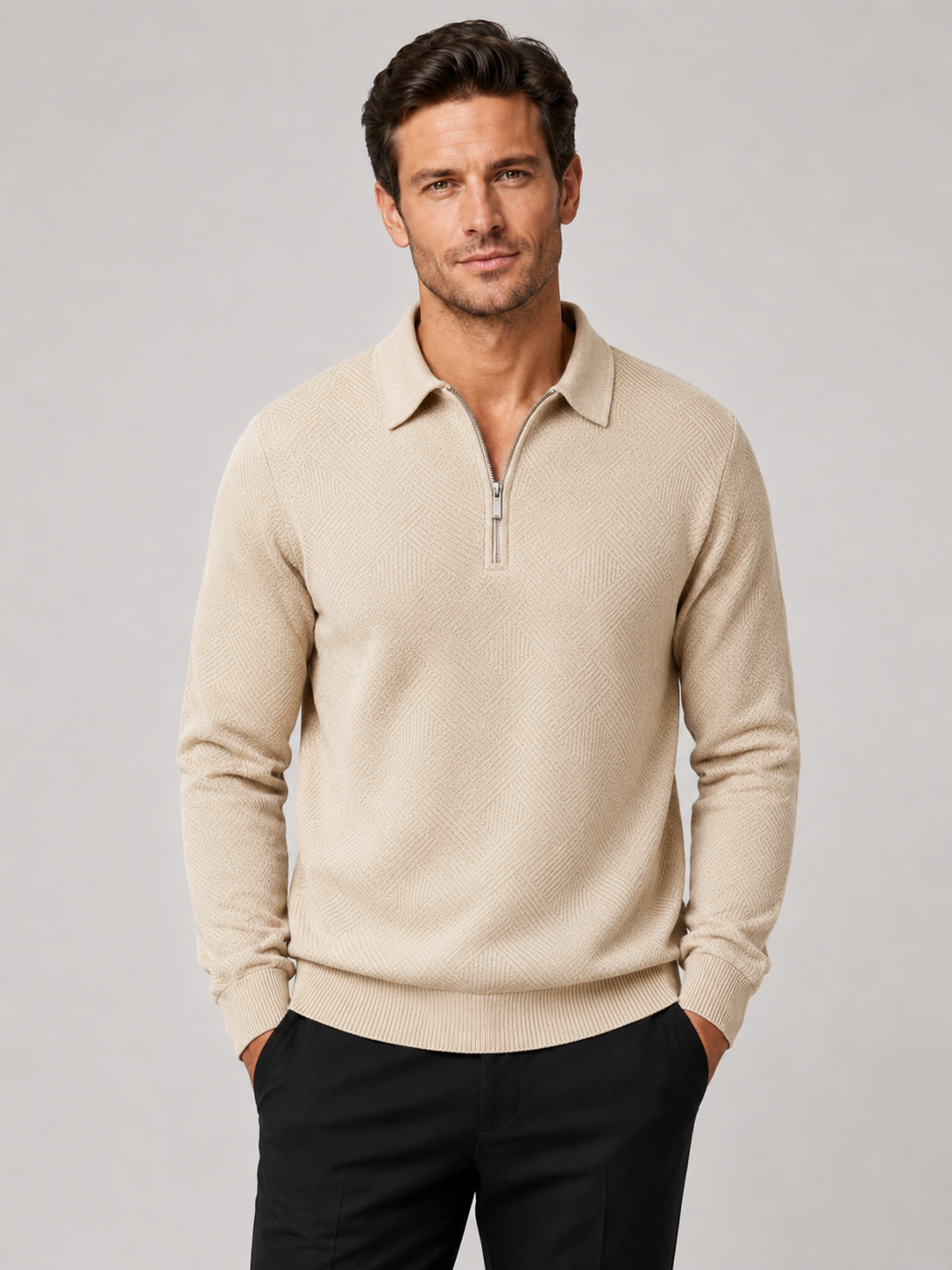 Front view of a man wearing a beige lightweight knit quarter zip polo sweater with long sleeves