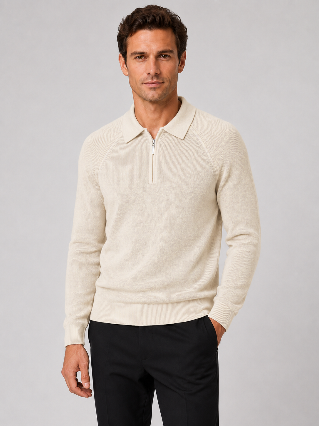 Front view of a man wearing a khaki slim fit quarter zip polo sweater with long sleeves and a knit collar