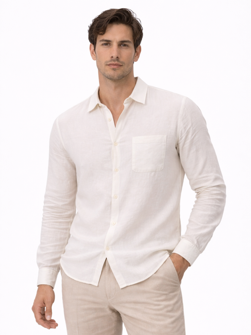 Man wearing a beige lightweight linen button-up shirt and beige pants on a white background