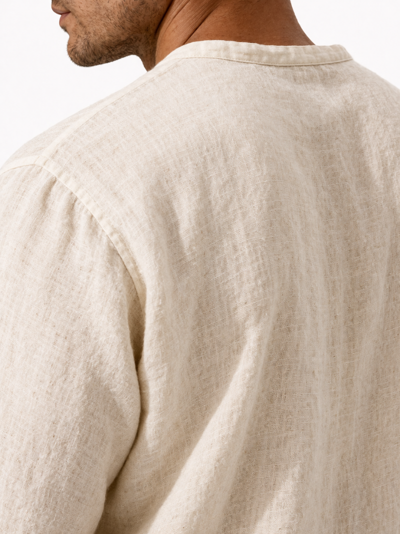 Men wearing beige organic linen shirt with V-neck, airy long sleeve summer essential outfit