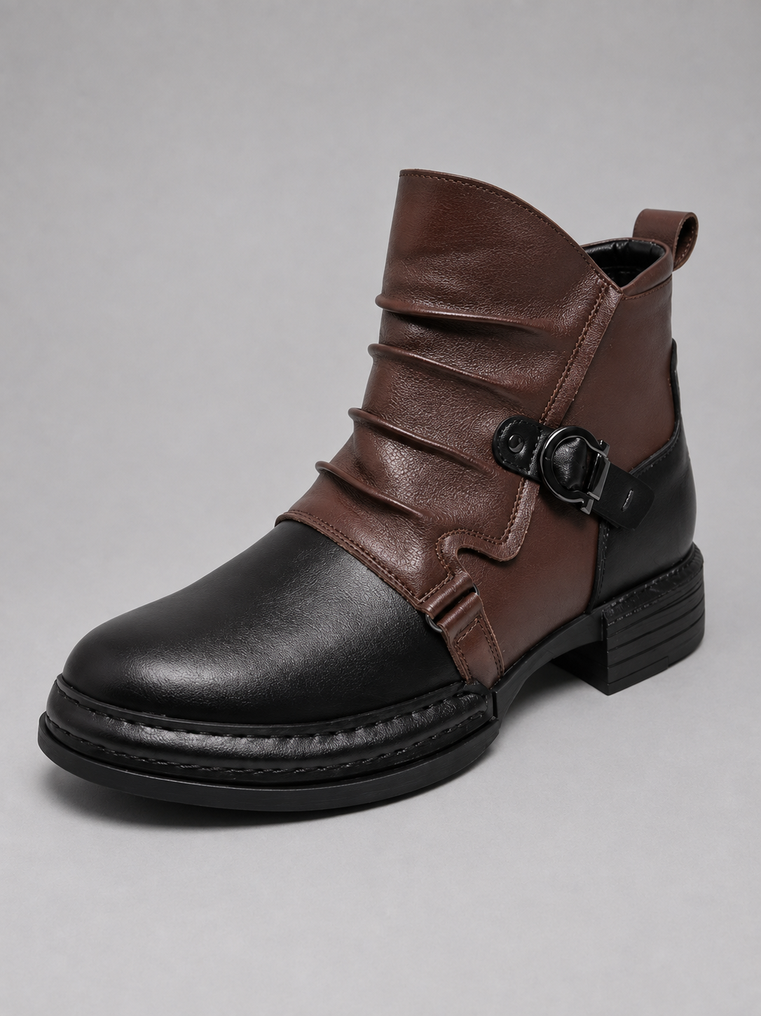 Front view of black zip-up leather ankle motorcycle boots with a rugged design for fall and winter casual outfits