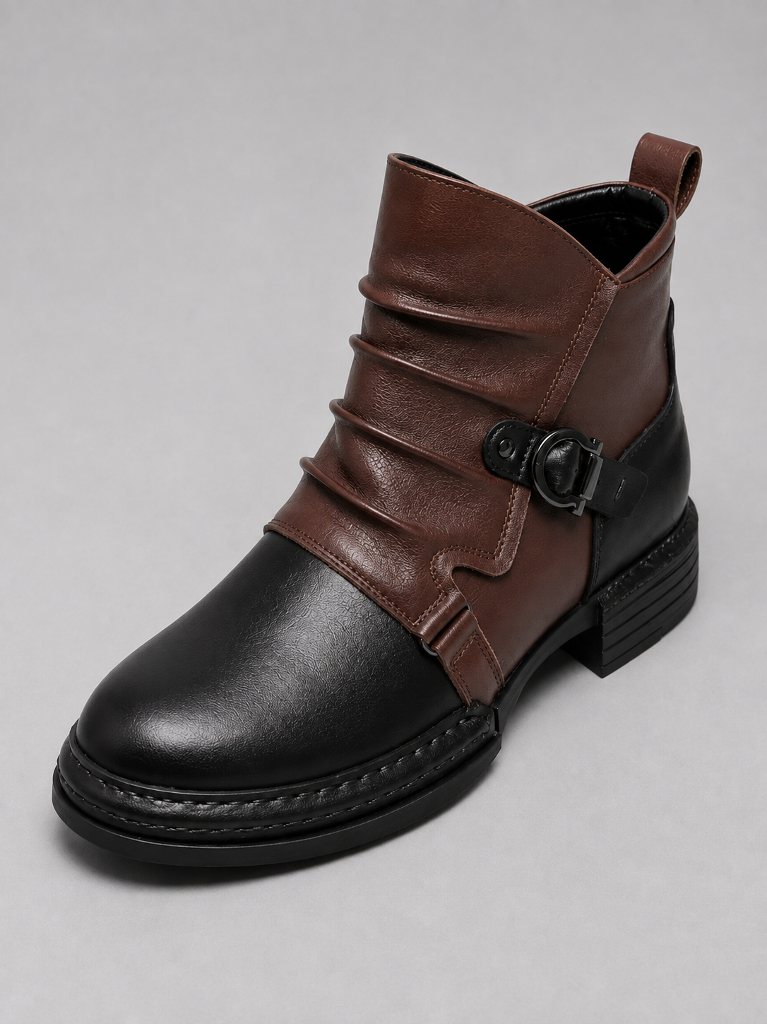 Top view of black men’s ankle motorcycle boots showing the premium leather texture, side zipper, reinforced stitching, treaded rubber sole, and toe cap