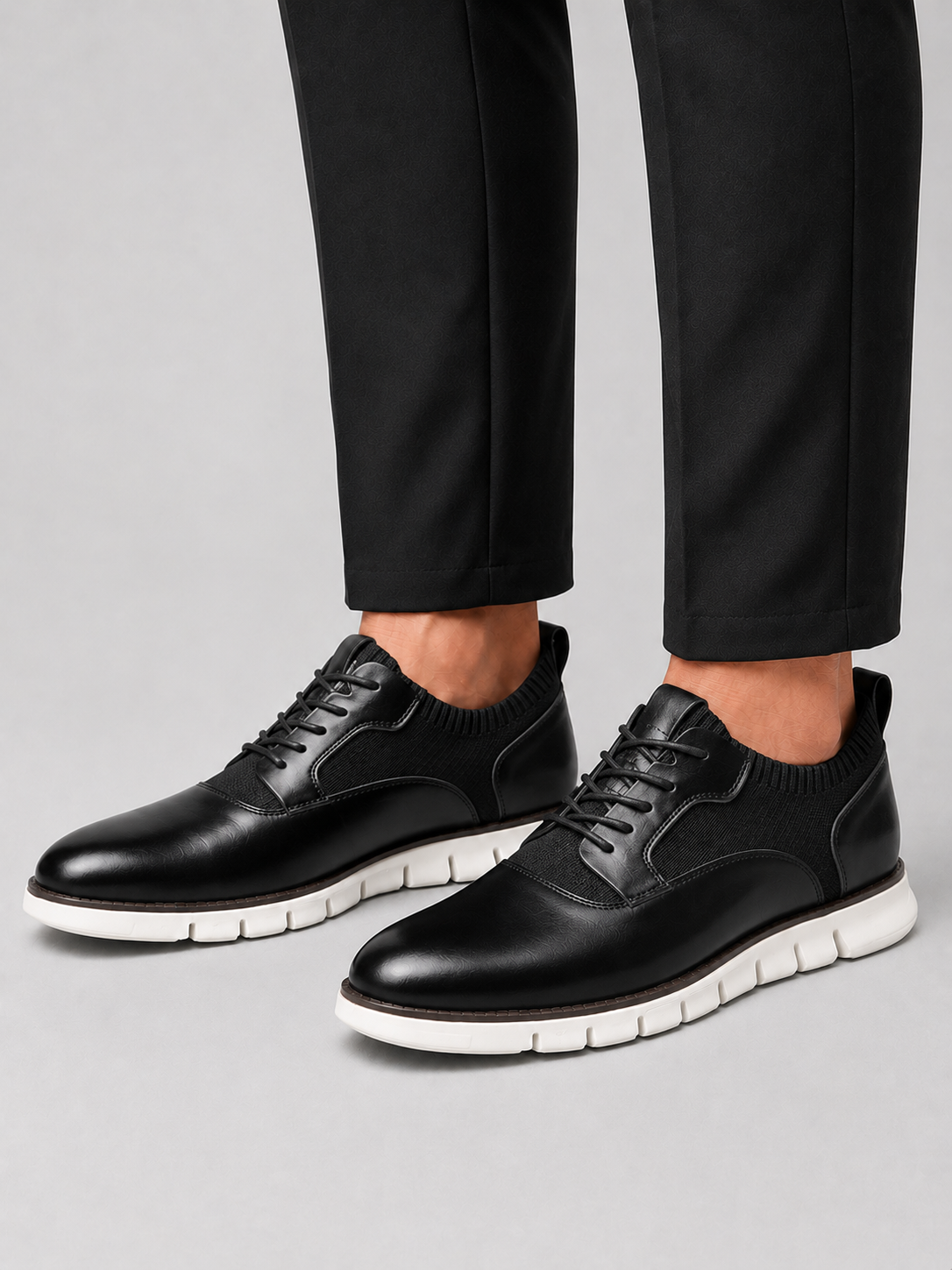 Man styling black comfort dress shoes in a polished office and everyday business casual outfit