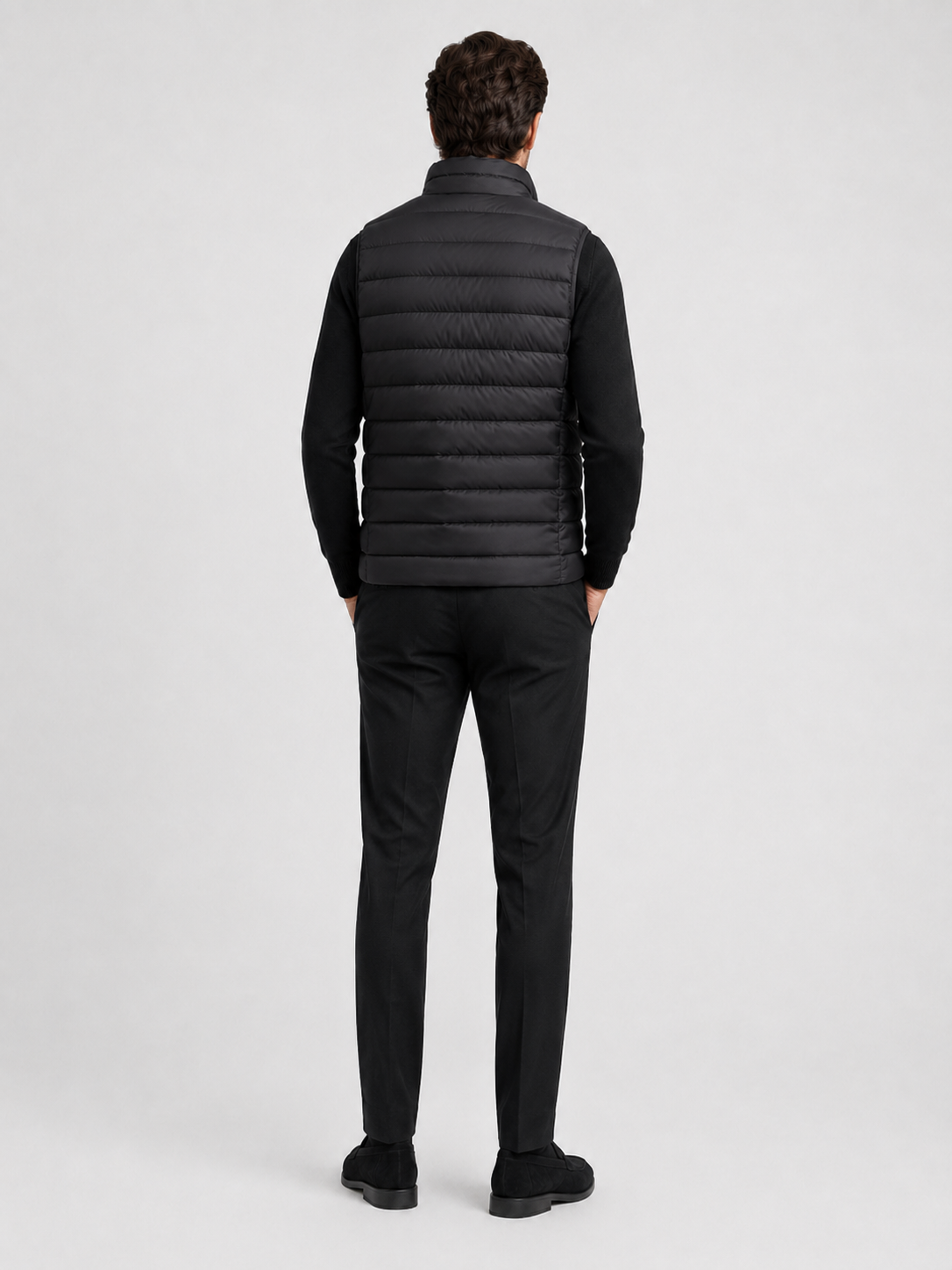 Men’s black insulated puffer vest comfortable sleeveless outerwear for hiking, travel, and casual outfits