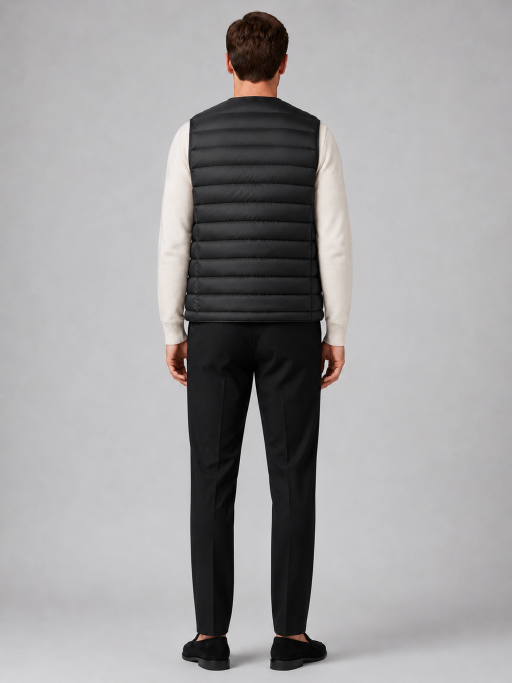 Men’s black insulated puffer vest comfortable sleeveless outerwear for hiking, travel, and casual outfits