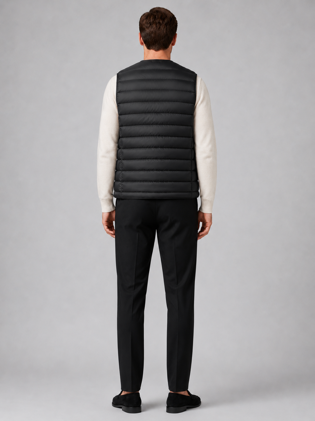 Men’s black insulated puffer vest comfortable sleeveless outerwear for hiking, travel, and casual outfits