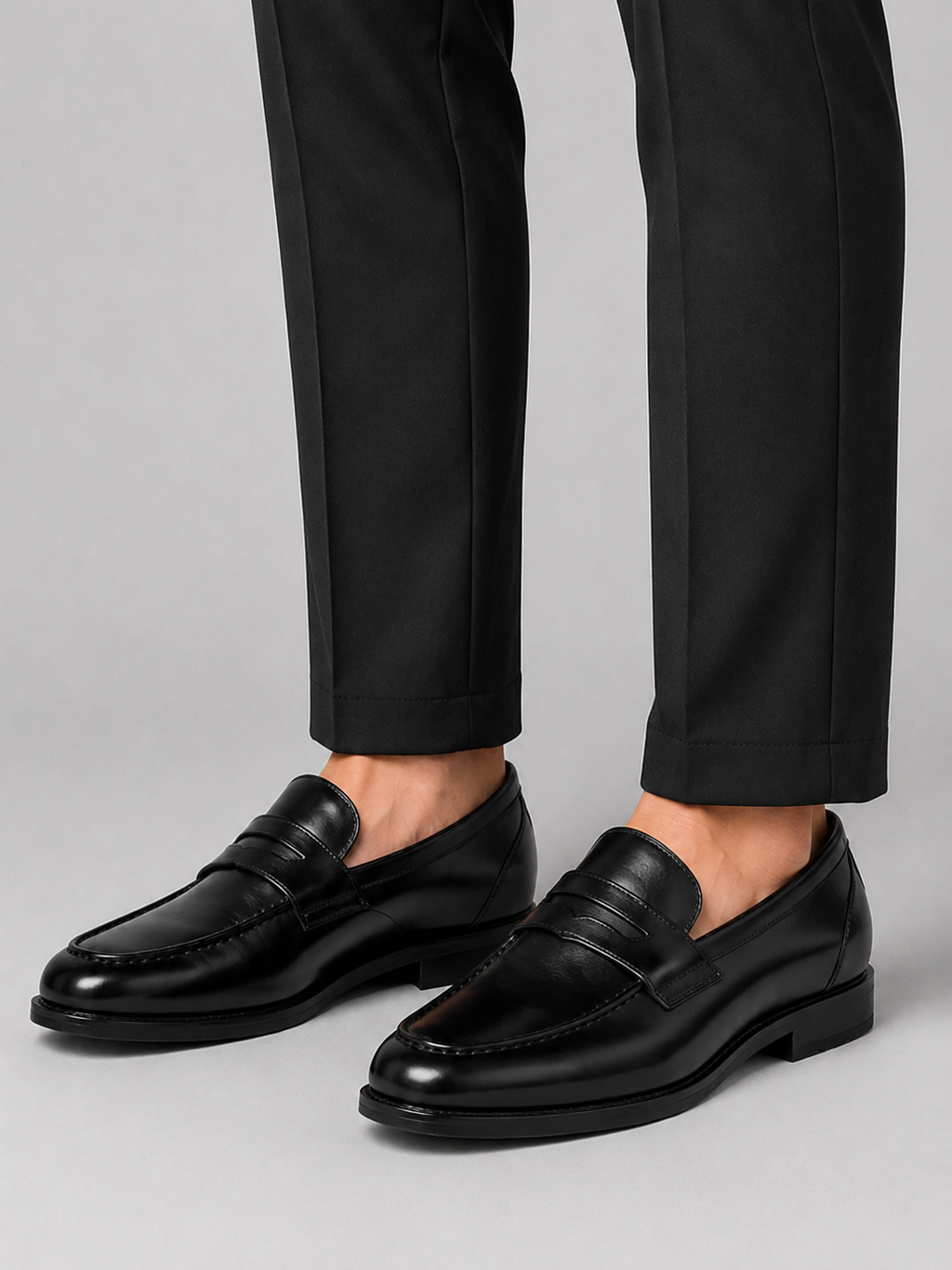 Man styling black genuine leather loafers with a polished office and wedding outfit