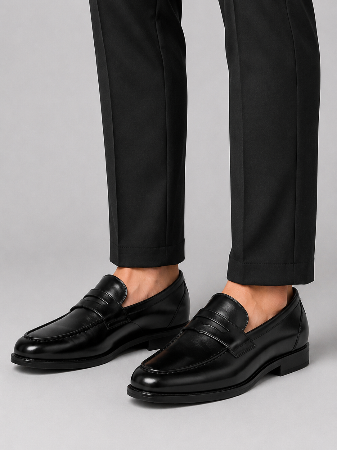 Man styling black genuine leather loafers with a polished office and wedding outfit