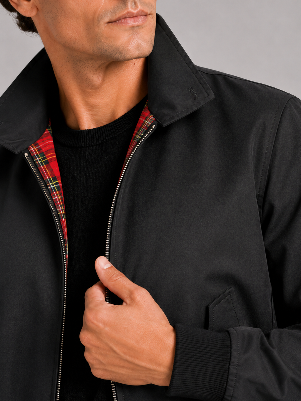 Close up of black Harrington jacket showing smooth breathable fabric and zipper detail