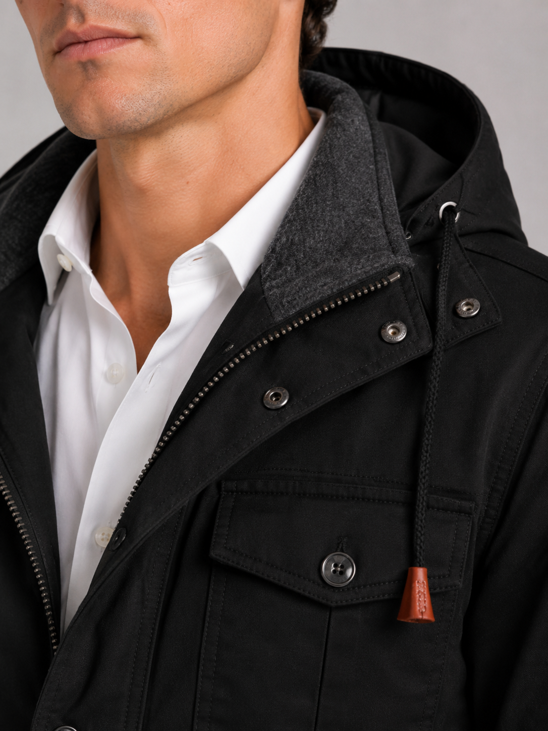 Close up of black cotton jacket showing soft fleece lining and durable zipper detail