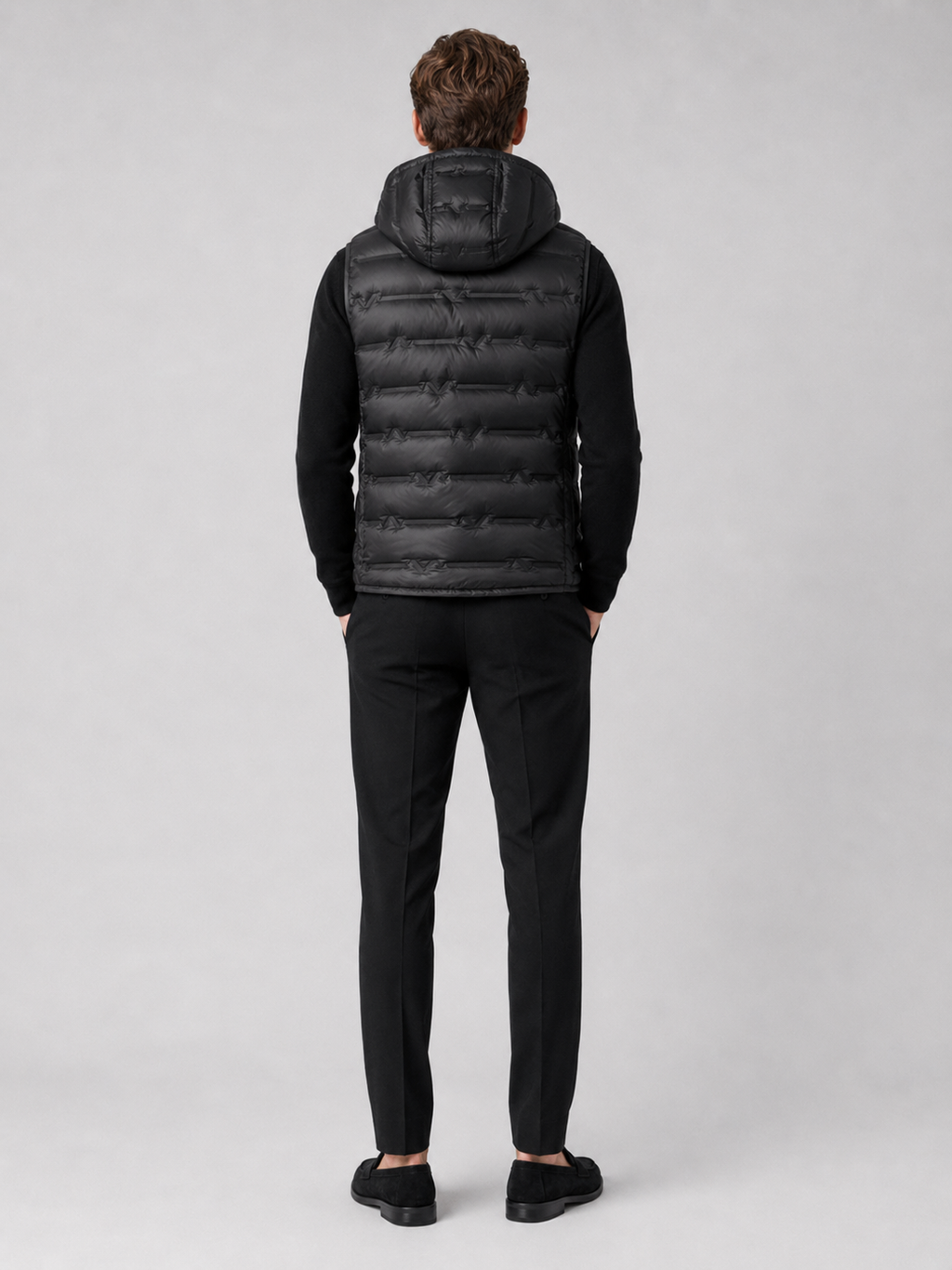 Men’s black insulated hooded puffer vest comfortable sleeveless outerwear for hiking, travel, and casual outfits