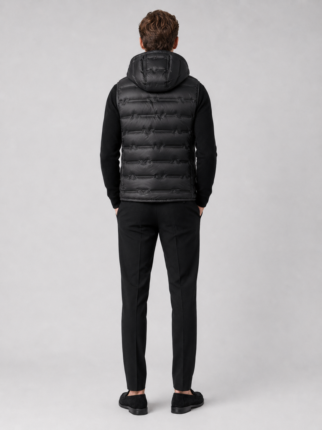 Men’s black insulated hooded puffer vest comfortable sleeveless outerwear for hiking, travel, and casual outfits