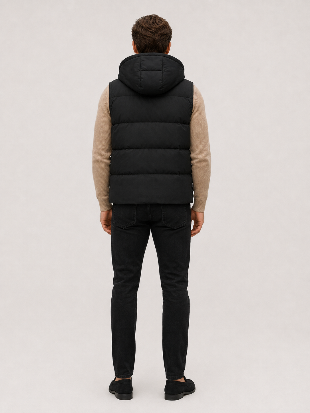 Black men’s thick insulated hooded puffer vest displayed on a plain background