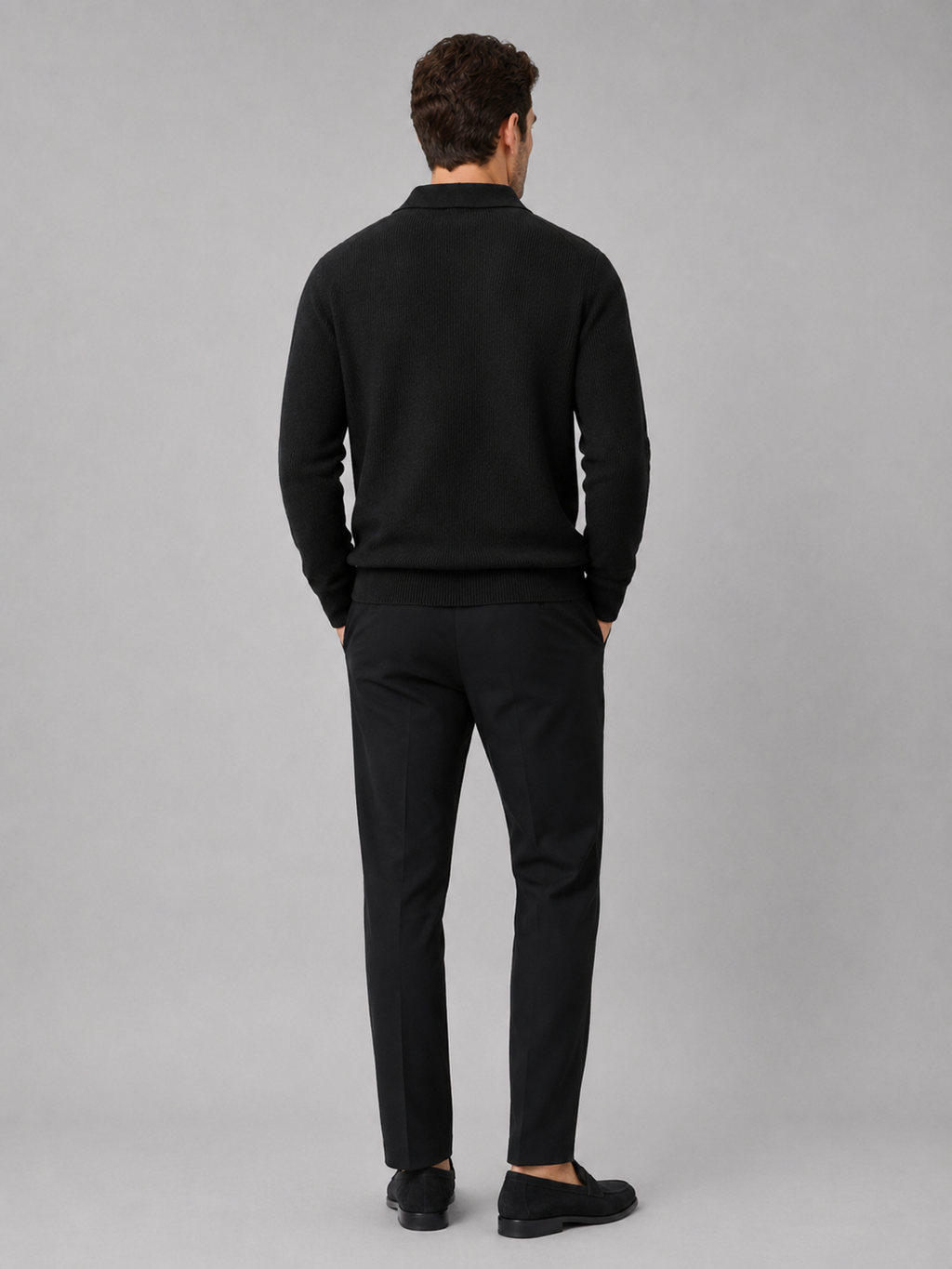 Back view of a man wearing a black Johnny collar sweater showing the heavyweight knit and relaxed fit