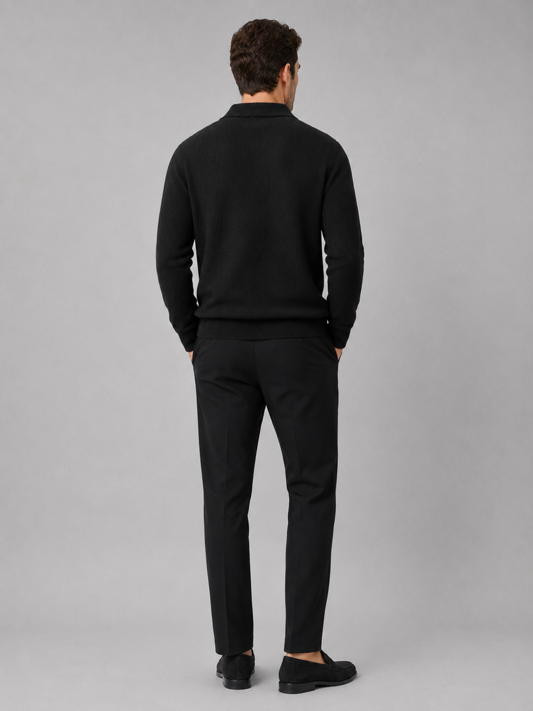Back view of a man wearing a black Johnny collar sweater showing the heavyweight knit and relaxed fit