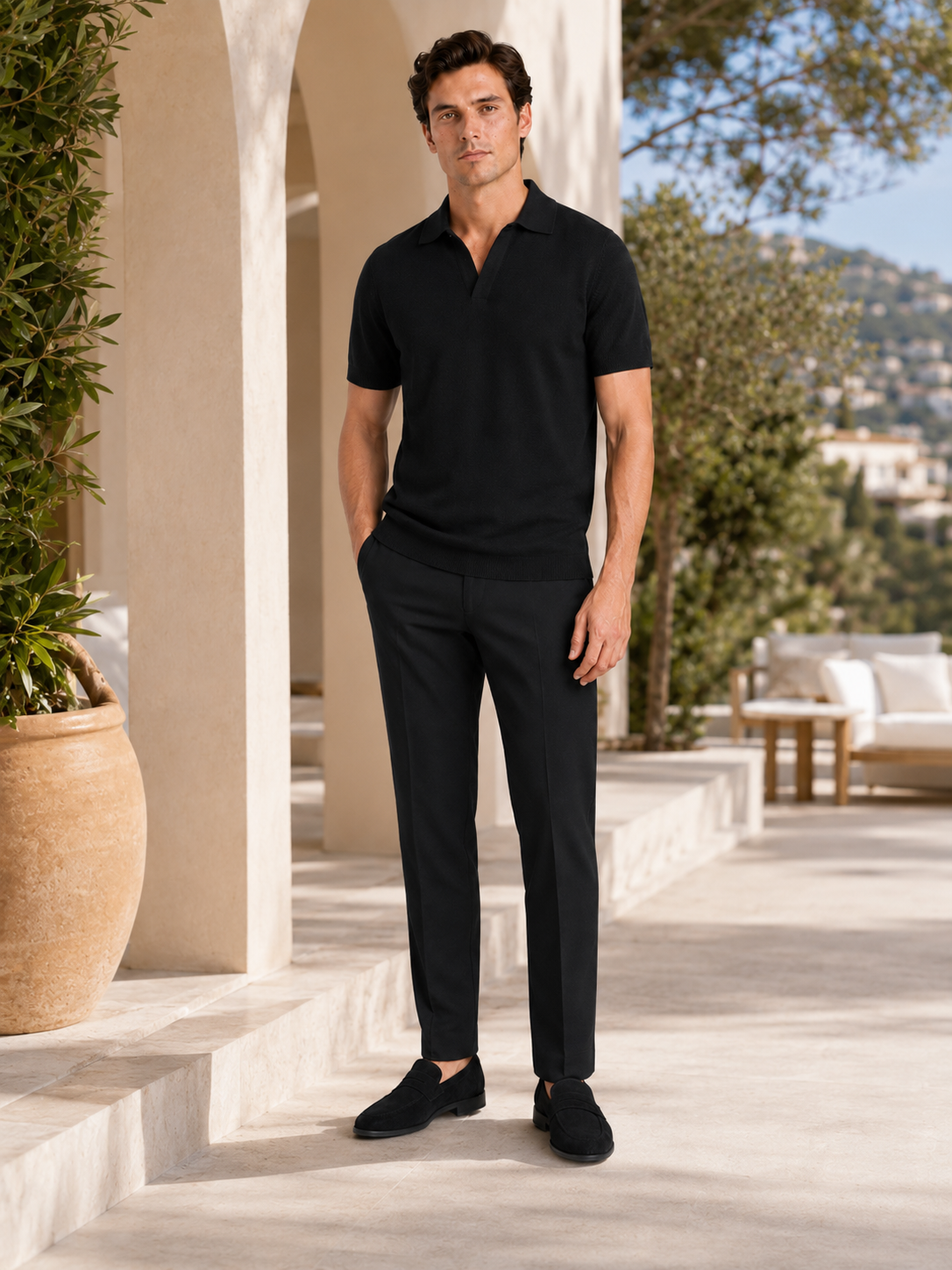 Man styling black knit polo t shirt in a modern summer business casual lifestyle outfit