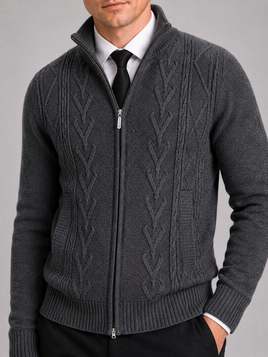 Close up of black full zip sweater showing thick knit texture and stand collar detail