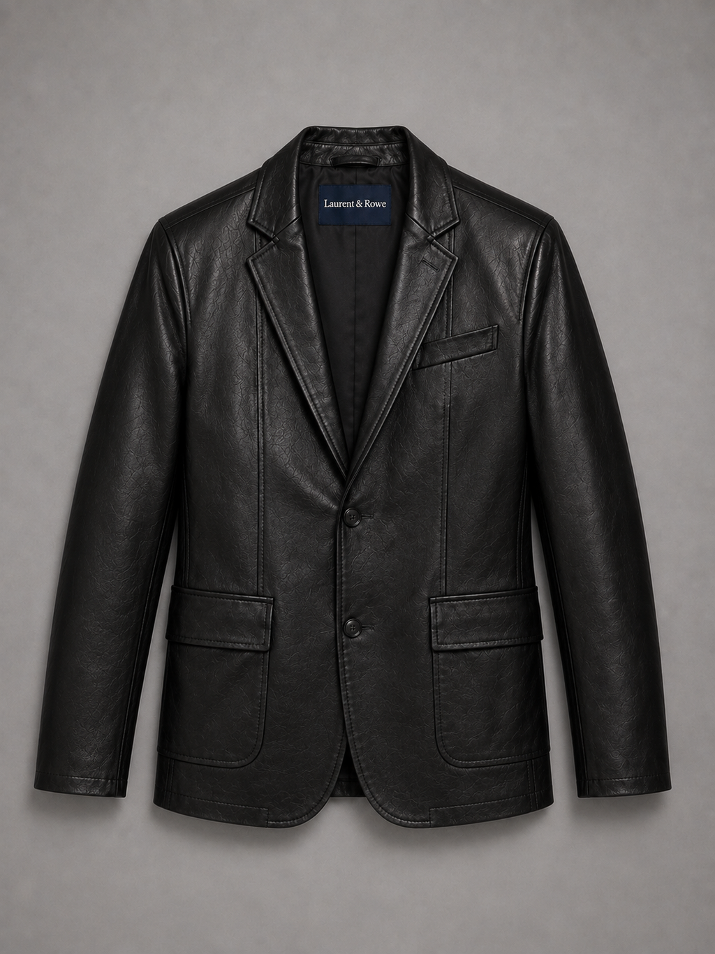 Black men’s leather blazer jacket with a slim fit and classic lapel displayed on a plain background