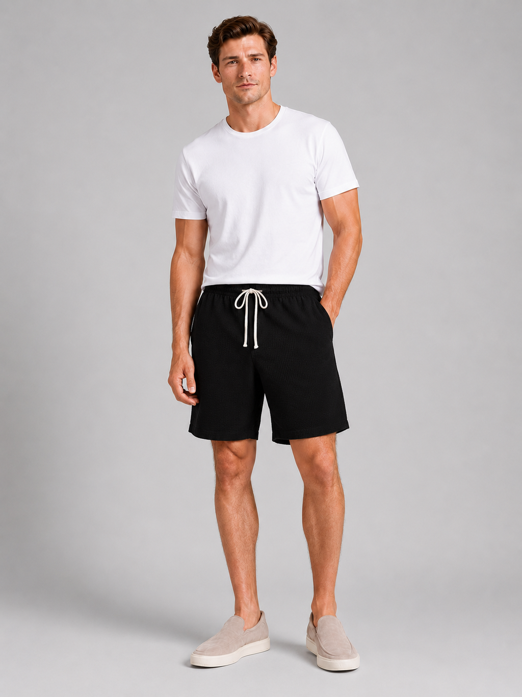 Men wearing black drawstring shorts waffle texture loose fit knee length summer casual style