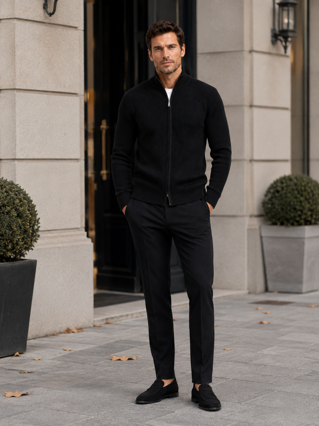 Man wearing a black ribbed knit full zip cardigan sweater in a casual fall winter outfit for everyday wear
