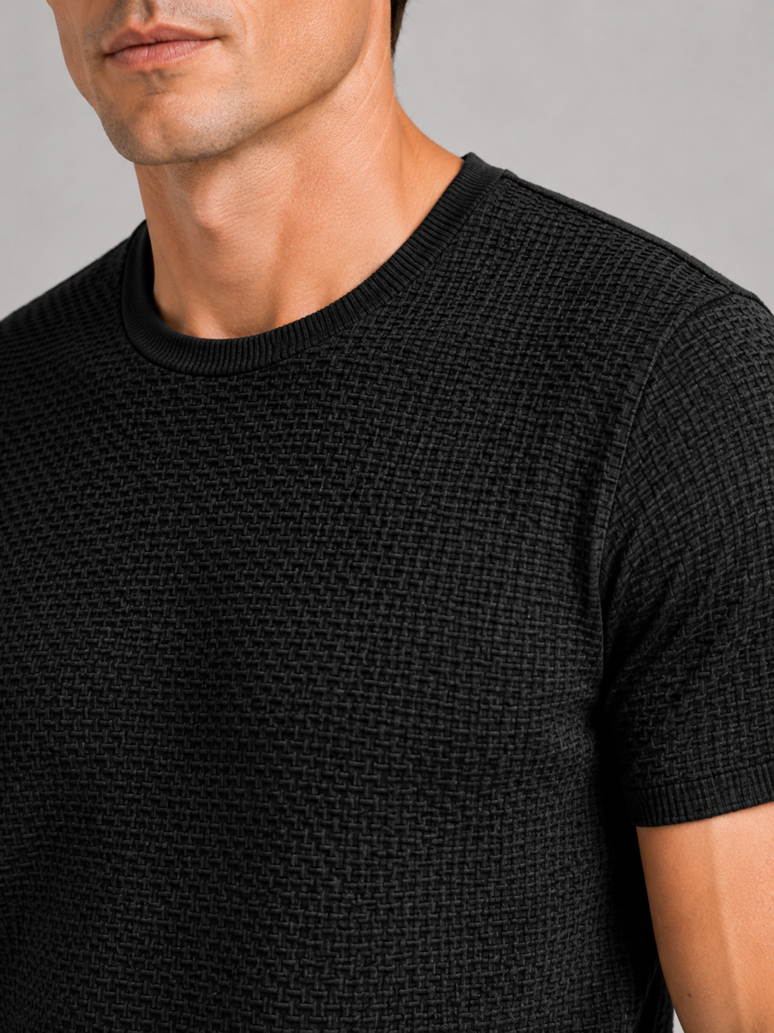 Close up of black mesh t shirt showing breathable texture and soft stretch fabric detail