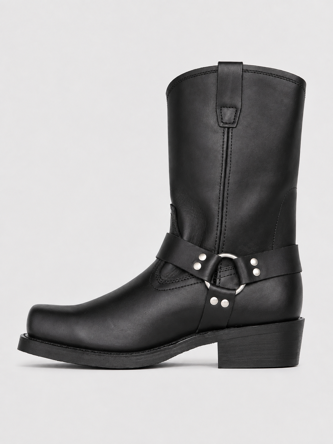 Side view of black men’s mid calf cowboy boots showing the leather upper, slip-on construction, western silhouette, stacked heel, and durable outsole