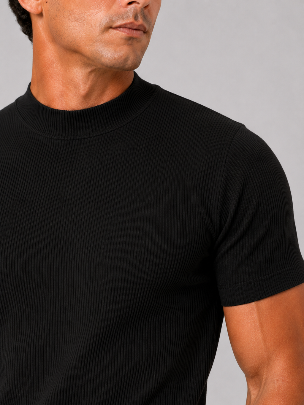 Close up of black ribbed t shirt showing soft stretch fabric and mock neck detail