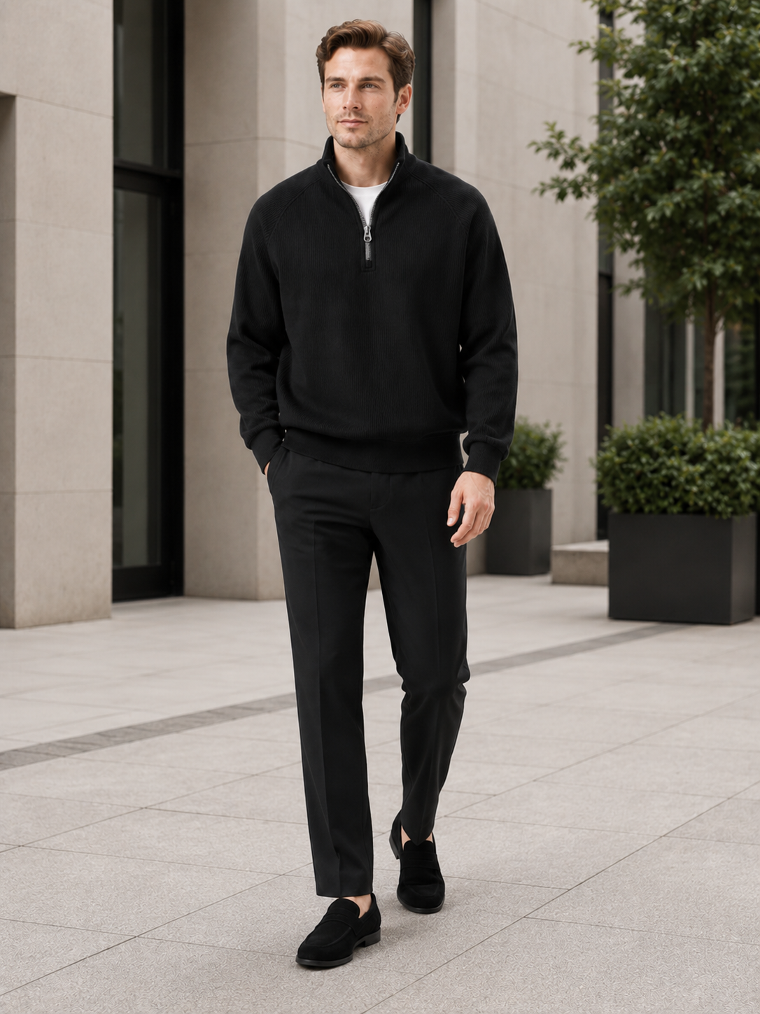 Man styling black quarter zip sweater in a modern everyday fall lifestyle outfit