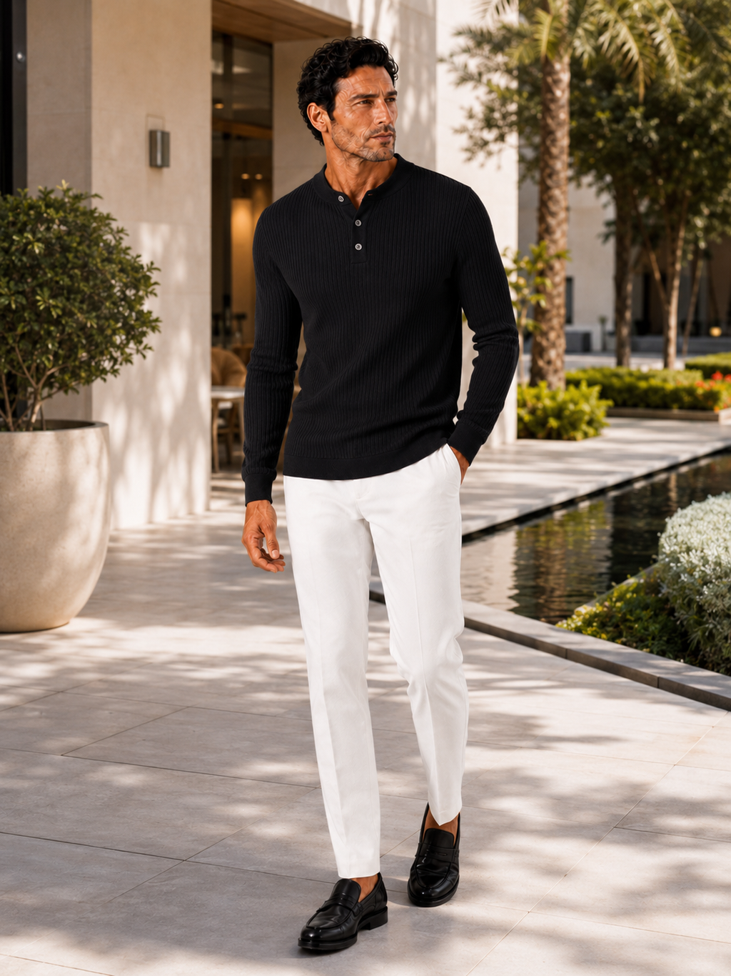 Man styling black henley polo shirt in a modern autumn business casual outfit