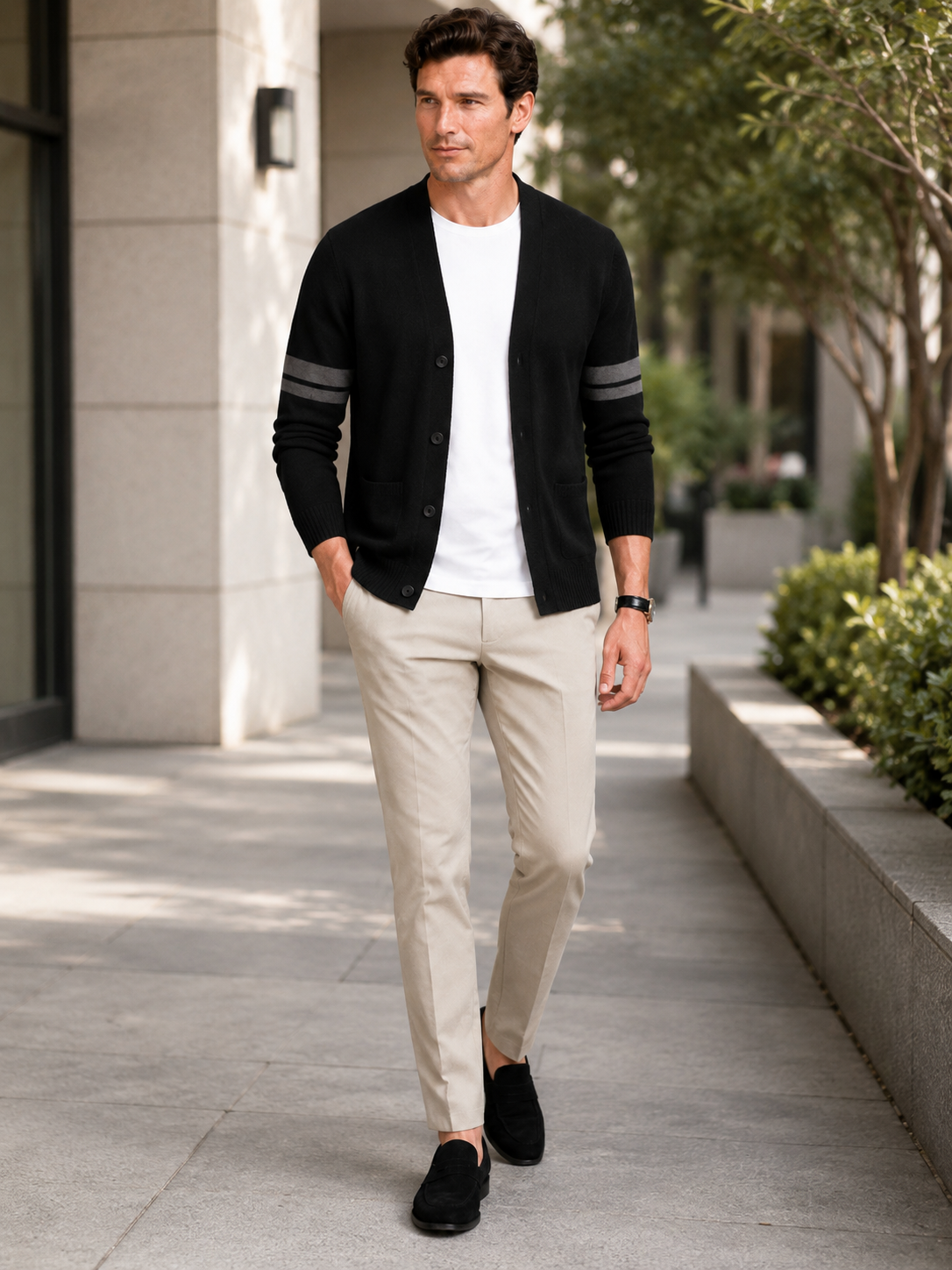 Man styling black striped cardigan sweater in a modern spring everyday lifestyle outfit