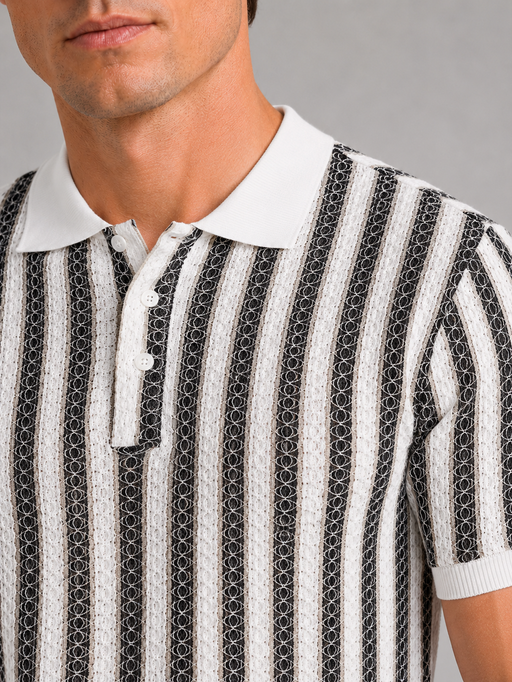Close up of black striped polo shirt showing smooth ice silk fabric and breathable knit texture