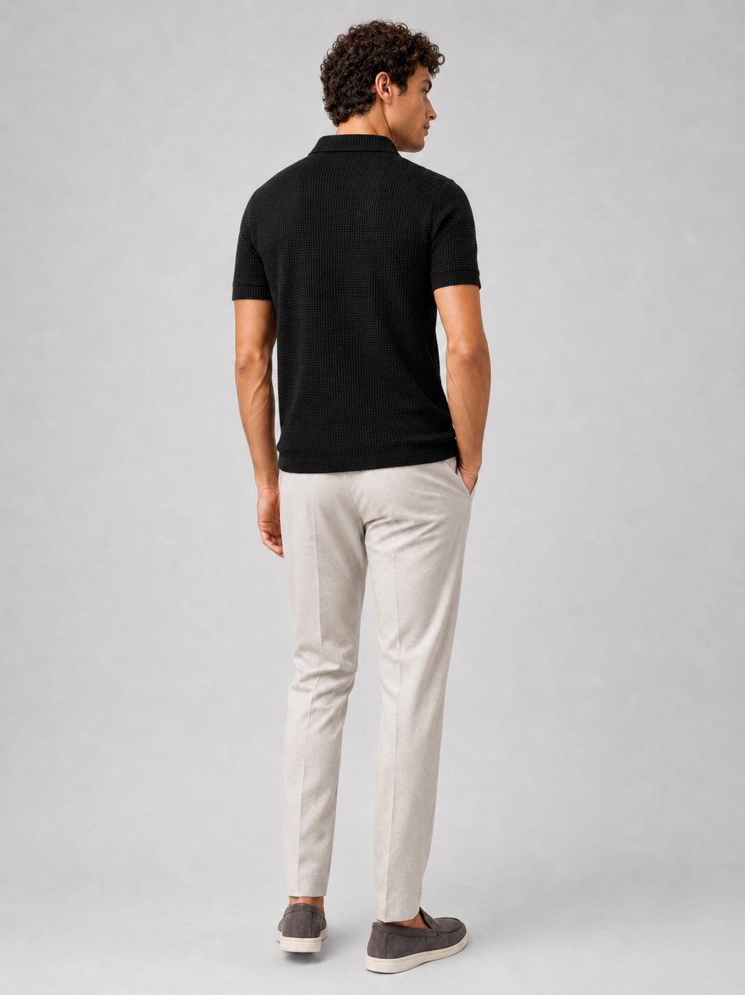 Black textured knit polo shirt for men lightweight breathable smart casual everyday outfit