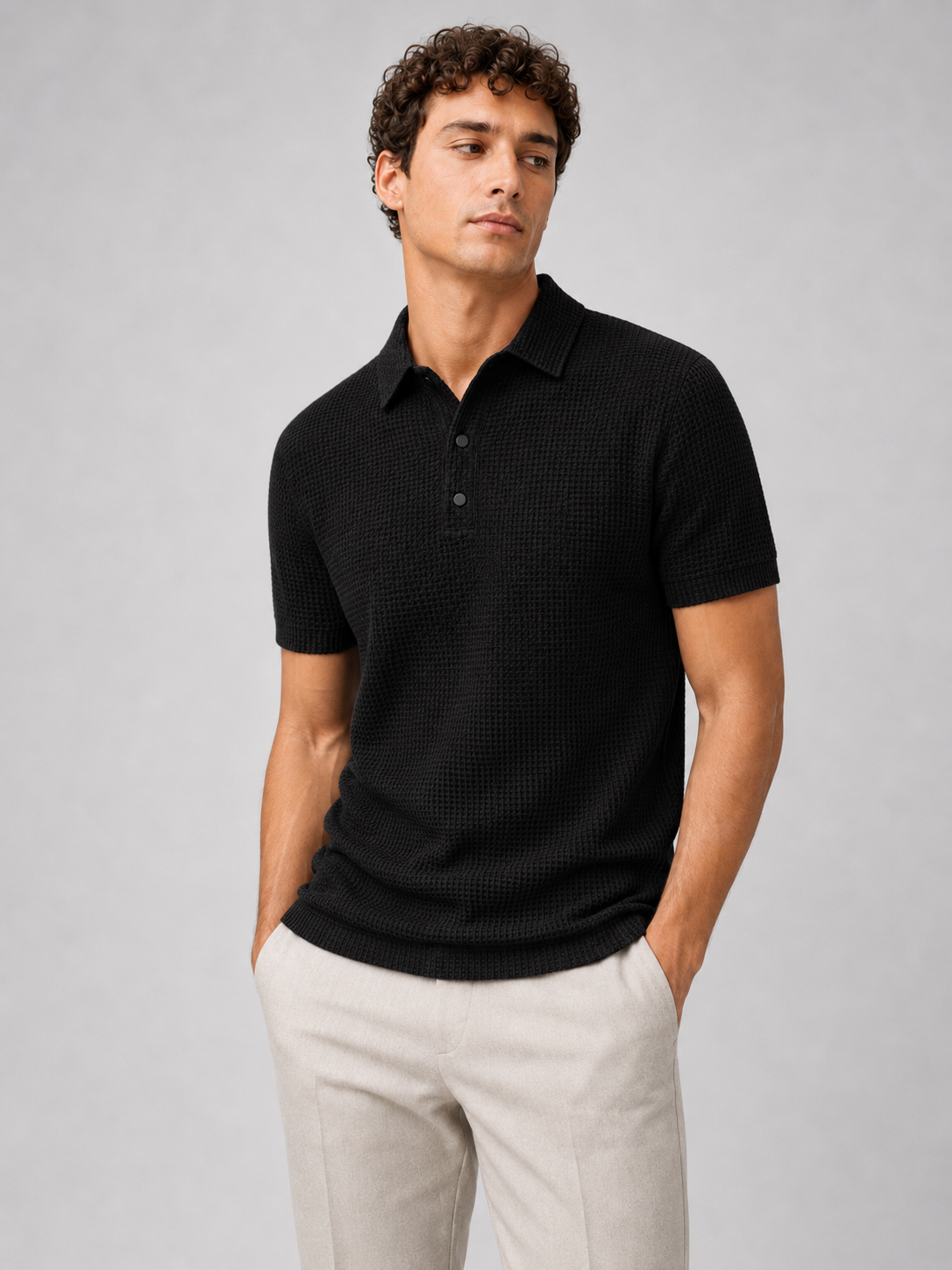 Men wearing black textured knit polo shirt short sleeve button placket business casual summer style