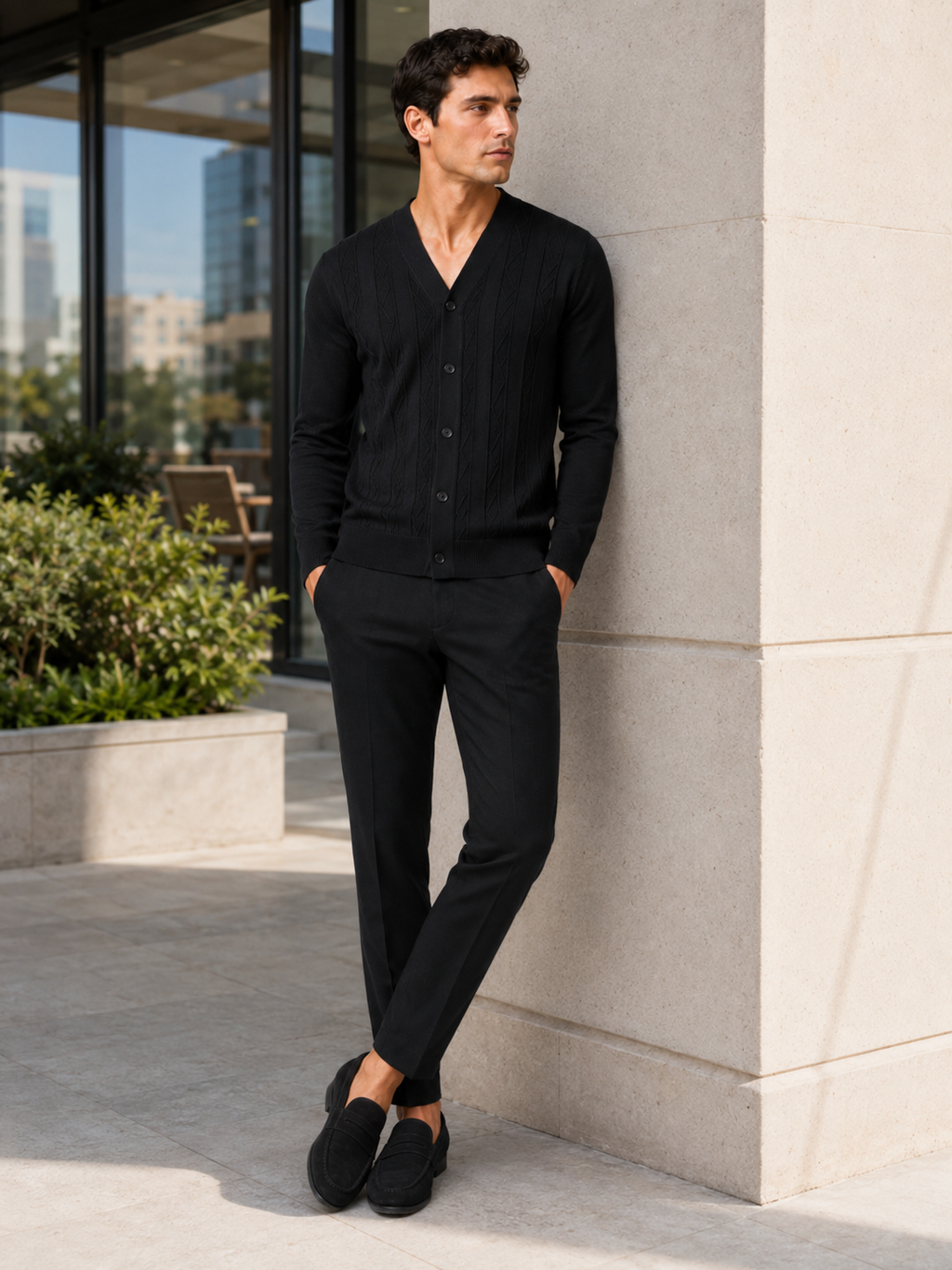 Man styling black v neck cardigan sweater in a modern everyday smart casual outfit