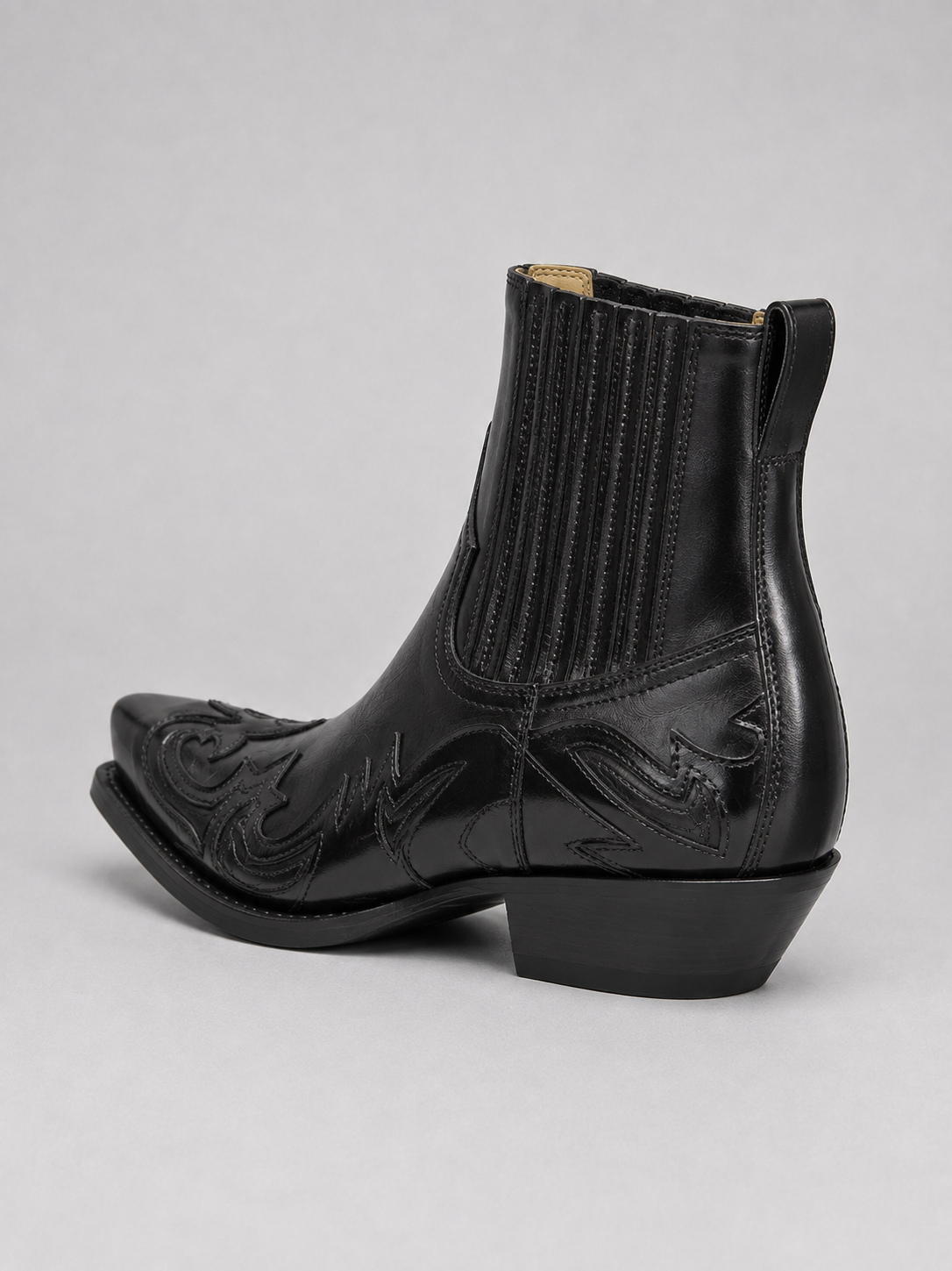 Back view of black men’s western cowboy boots showing embroidered details, pull tabs, heel, and durable outsole