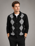 Front view of a man wearing a beige argyle cardigan sweater with a button-down front, turn-down collar, long sleeves, and thick knit texture