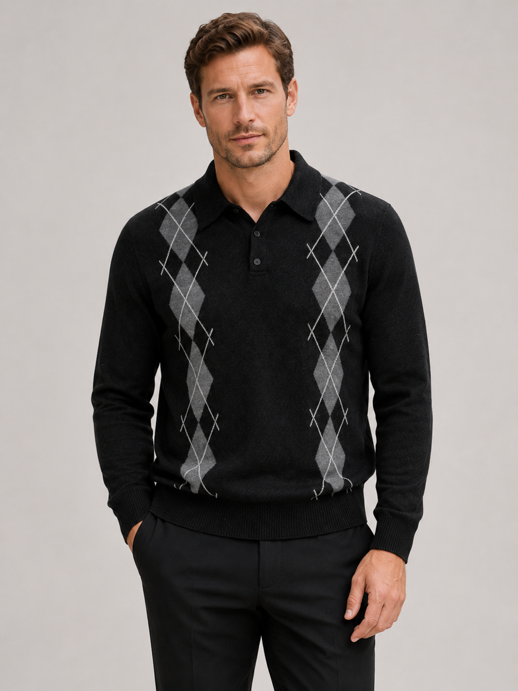 Front view of a man wearing a black argyle sweater with a contrast collar, long sleeves, and classic plaid knit pattern