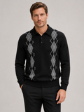 Front view of a man wearing a black argyle sweater with a contrast collar, long sleeves, and classic plaid knit pattern