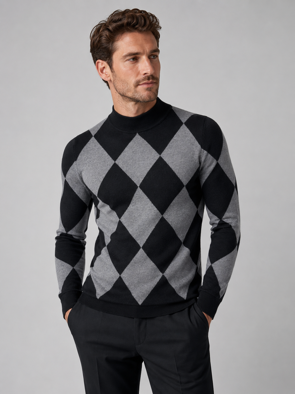 Front view of a man wearing a black argyle turtleneck sweater with a slim fit, stretch knit fabric, and long sleeves