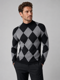 Front view of a man wearing a black argyle turtleneck sweater with a slim fit, stretch knit fabric, and long sleeves