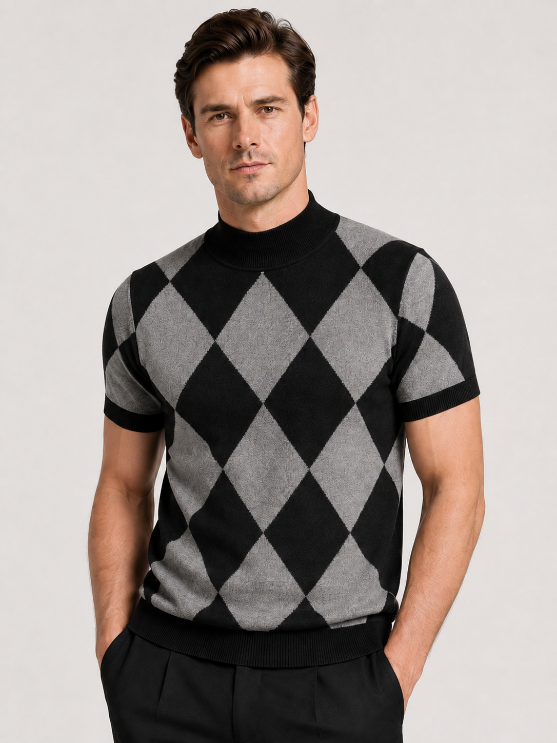 Front view of a man wearing a black argyle turtleneck T-shirt with a slim fit, diamond lattice pattern, short sleeves, and soft knit construction